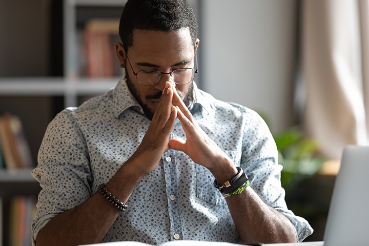 businessman with glasses concerned and thinking