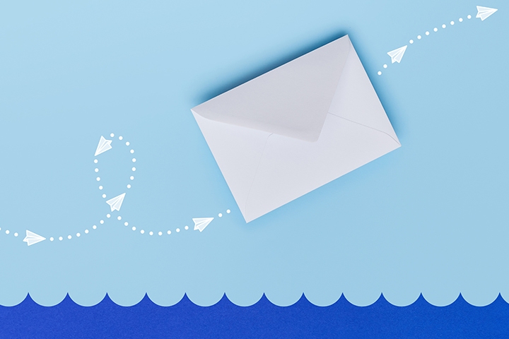 envelope with blue background and twisting white arrow