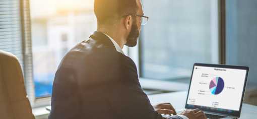 man looking at charts on screen man looking at charts on screen