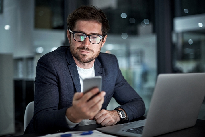 man looking at phone